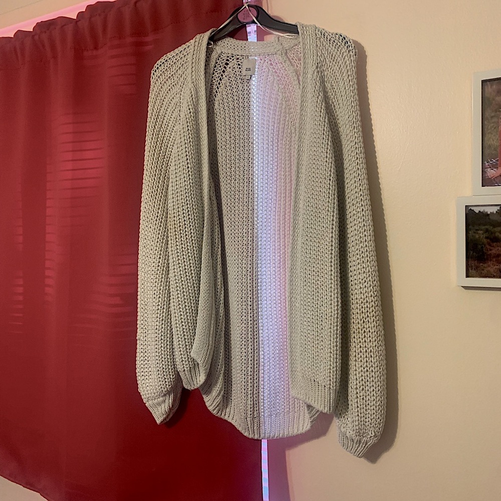 Cream/ Off White Holey Sweater. It is and XS but fits like a S